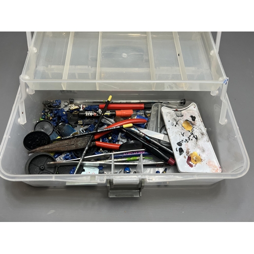 79 - Warhammer carry case with a good quantity of spare/repair figures. Shipping Group (A).