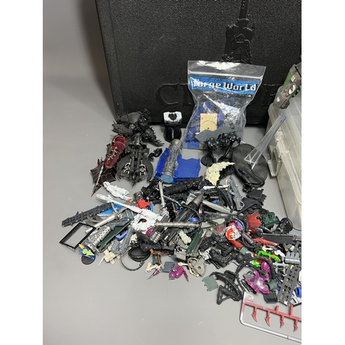 79 - Warhammer carry case with a good quantity of spare/repair figures. Shipping Group (A).