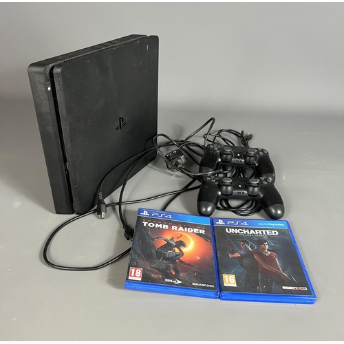 106 - Playstation 4 with 2 controllers plus 2 games; Tomb Raider and Uncharted. Shipping Group (A).