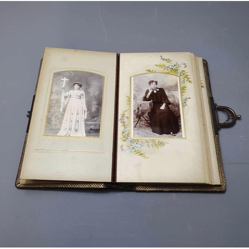 61 - A Victorian Carte de visite album holding approx 35 post cards. Shipping group (A), optional combine... 