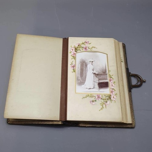 61 - A Victorian Carte de visite album holding approx 35 post cards. Shipping group (A), optional combine... 