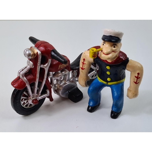 35 - Cast metal figure of Popeye on a motorcycle. Measuring 16cmx22cm. Shipping group (A), optional combi... 