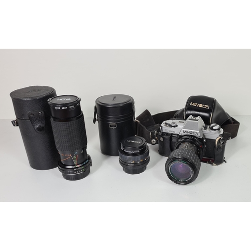 68 - Minolta X300 camera together with additional lenses. Shipping group (B), optional combined shipping ... 