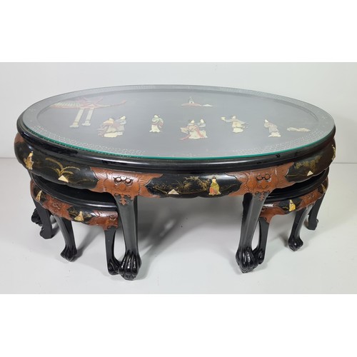 75 - A fine Oriental black lacquered coffee table with four stools under. Hand decorated with C19th scene... 