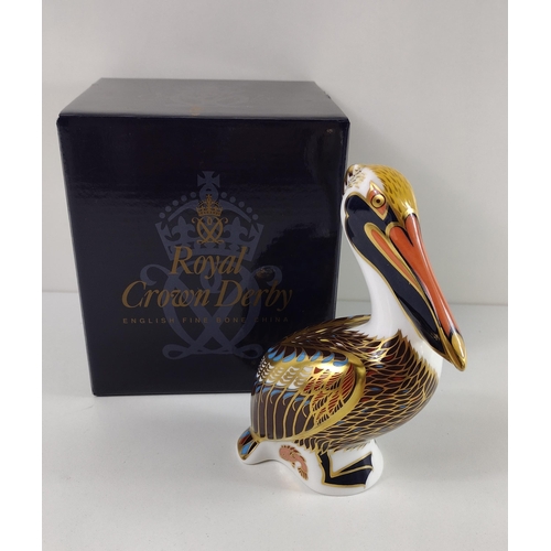 152 - Royal Crown Derby pelican with gold stopper and original box. Shipping group (A), optional combined ... 