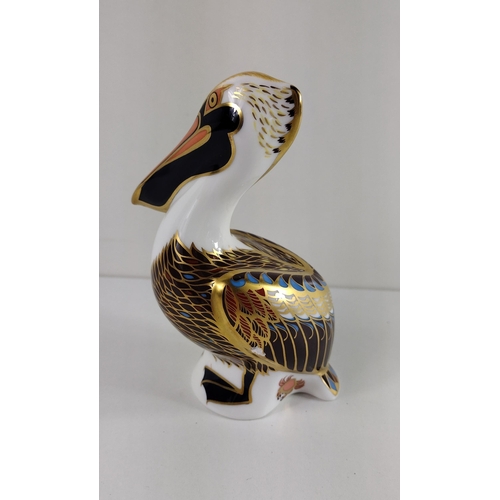 152 - Royal Crown Derby pelican with gold stopper and original box. Shipping group (A), optional combined ... 