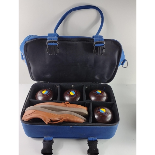 182 - Set of 4 lawn bowls and a pair of bowling shoes. Collection in person / your own courier.