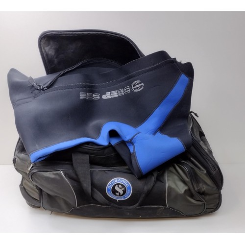 376 - Scubapro bag and 2 wetsuits. Shipping group (C), optional combined shipping or collection in person ... 