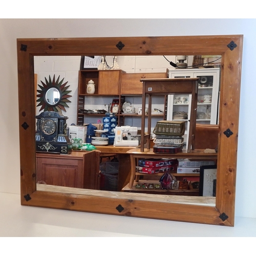 378 - Large wall mirror in wooden frame with metal stud decoration. Collection in person / your own courie... 