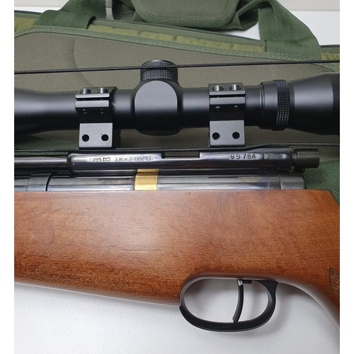 263 - Circa 1950's Falcon .22 PCP air rifle in excellent condition, complete with telescopic sight and car... 