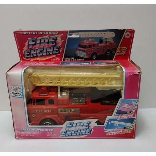 24 - Boxed battery operated toy fire engine. Shipping Group (A).