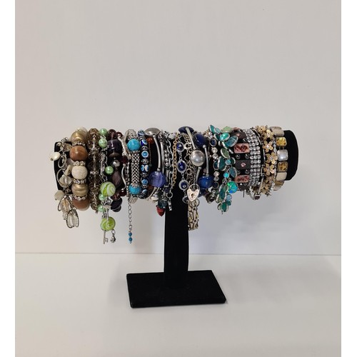 3 - Good assortment of bracelets and bangles (display stand not included). Shipping Group (A).