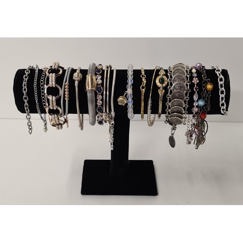 69 - Large quantity of fashion bracelets (display stand not included). Shipping Group (A).