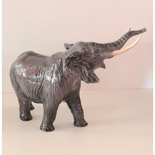 114 - Large Beswick bull elephant standing 25cm. Collection only.