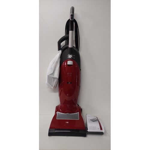 350 - Near-new Miele upright vacuum cleaner in working order with manual and accessories. Shipping Group (... 