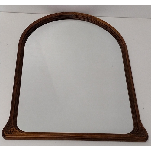 425 - Arched over mantle mirror set in nicely carved wooden frame, 100x74cm. Collection only.