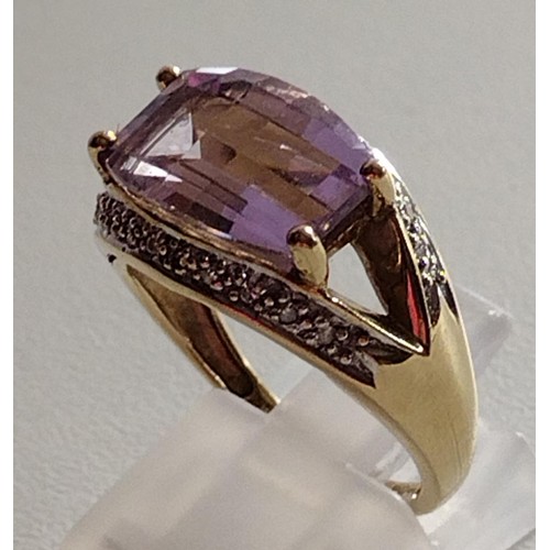 57 - 9ct gold diamond and amethyst ring, size O. Shipping Group (A).