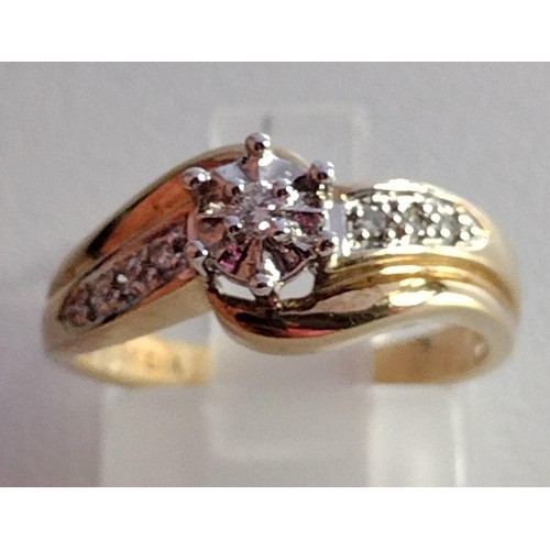 74 - 9ct gold diamond solitaire ring having diamond set shoulders, size K½. Shipping Group (A).