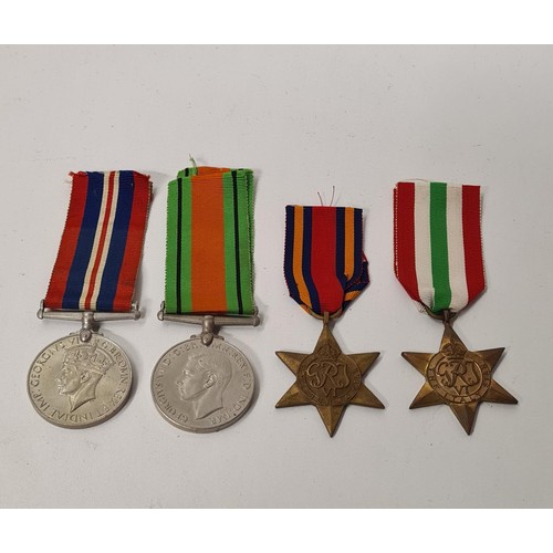 179 - WWII medal group comprising: 1939/45 Service Medal, Defence Medal, Burma Star and Italy Star. Shippi... 