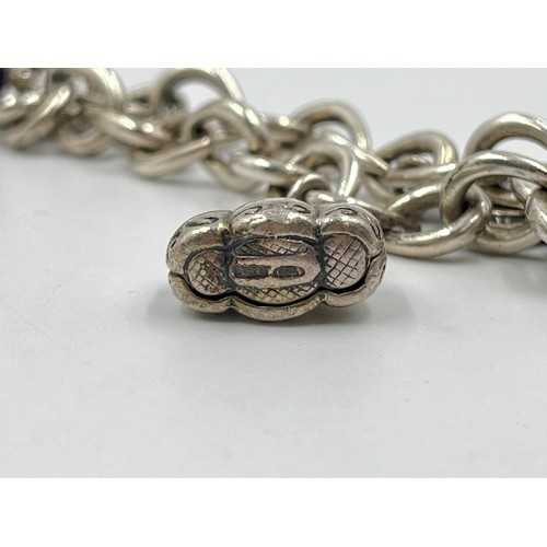 45 - .925 silver charm bracelet. Weight 36g. Shipping Group (A).