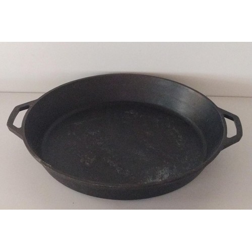 226 - Large cast iron pan measuring 44cm in diameter. Collection only.