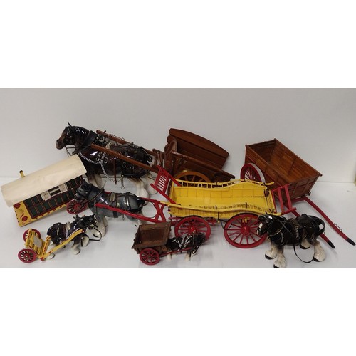 231 - Assorted horse and cart figures, largest being 60cm in length. Collection only.