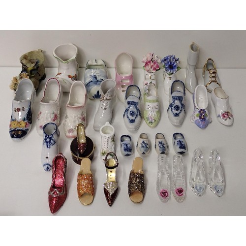 237 - Good assortment of collectable ceramic and glass shoes and boots. Collection only.