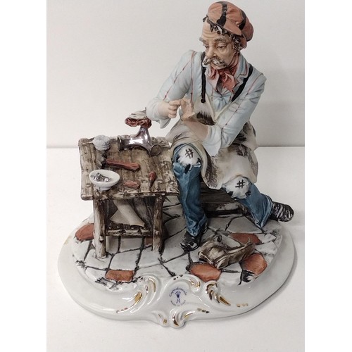 263 - Capodimonte figure 'The Shoe Maker' H:26 x W:25 cm. Shipping Group (A).