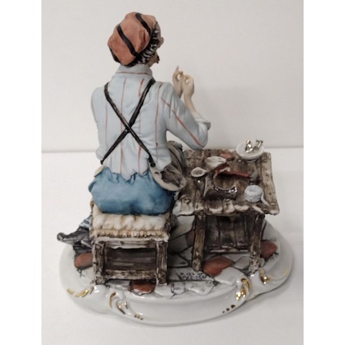 263 - Capodimonte figure 'The Shoe Maker' H:26 x W:25 cm. Shipping Group (A).