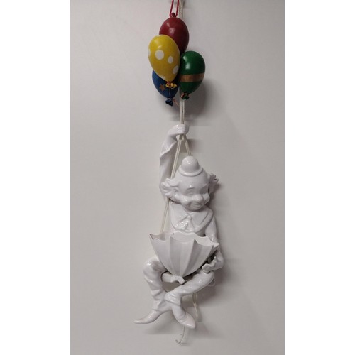 270 - Decorative porcelain hanging wall plaque in the form of a Clown holding a bunch of balloons. H:68 cm... 