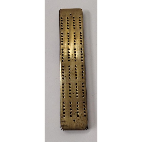 285 - Very heavy brass cribbage score board. Shipping Group (A).