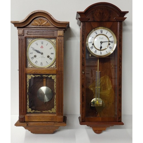 292 - (2) wooden cased pendulum clocks, one being a 31 day chime.  Collection only.