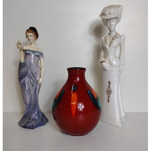 296 - Poole Pottery bud vase in the 'Volcano' pattern H:14 cm together with a Royal Doulton figurine 'Harm... 