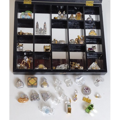 303 - Collectors cabinet with quantity of assorted miniature trinkets. Collection only.