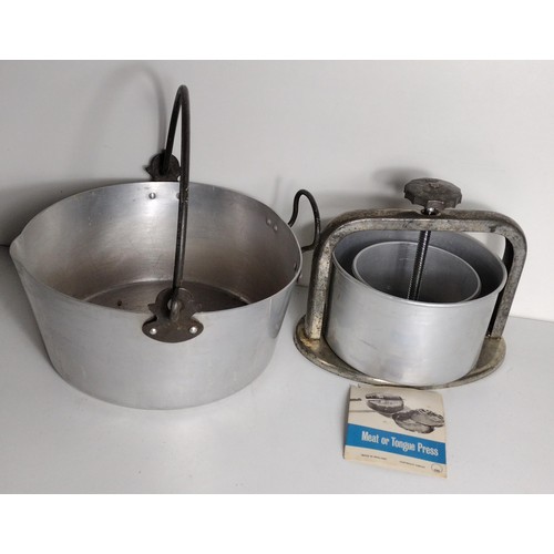 349 - Large aluminium jam kettle and a meat/tongue-press. Shipping Group (A).