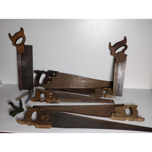 386 - 7 vintage hand saws, 6 of which being by Disston (USA) the other being Canadian Medallion, together ... 