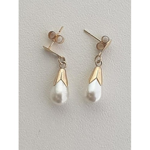 32 - Pair of 9ct gold natural pearl teardrop earrings. Shipping Group (A).