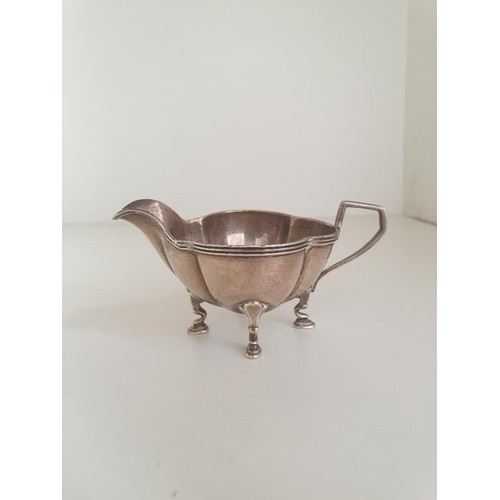 24 - Silver sauce boat and double handed trophy, hallmarks for Sheffield and Birmingham. Shipping Group (... 