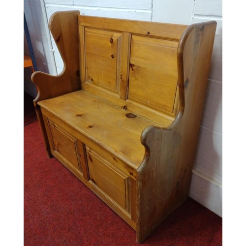 309 - Pine settle of small proportions, having lift-up seat and storage cupboard. H:90 x W:90 x D:40 cm. C... 