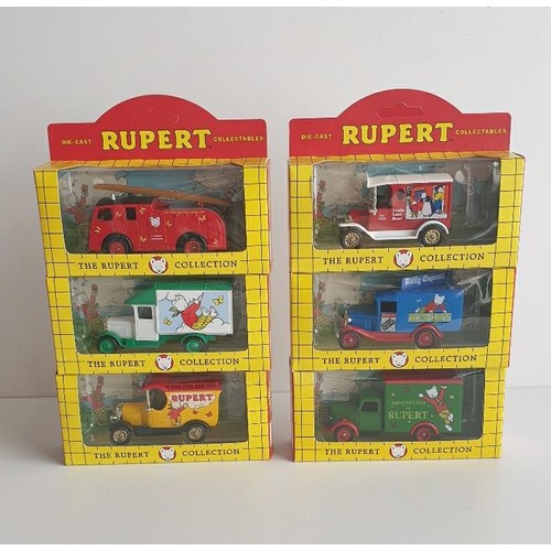 241 - (6) Die cast Rupert collection model vehicles Shipping Group (A).