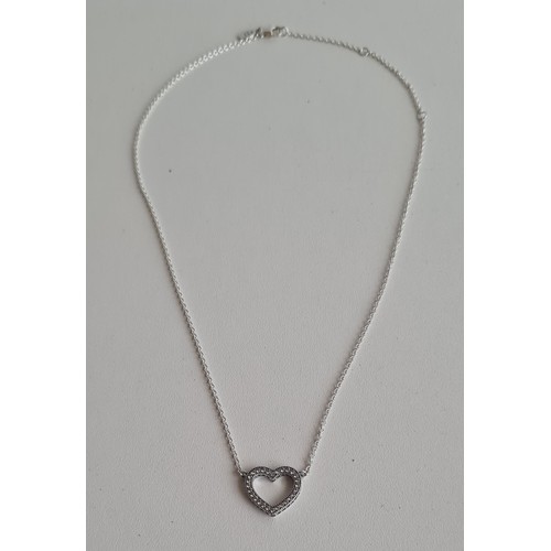 76 - Pandora .925 silver and cubic zirconia open heart pendant on chain. Shipping Group (A).