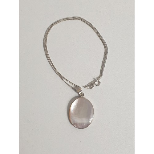 35 - Silver and Mother of Pearl pendant on chain. Shipping Group (A).