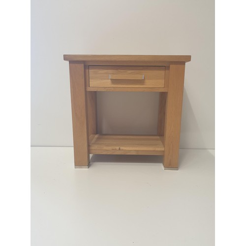 170 - Modern light oak occasional table having central drawer and undershelf. Measuring H:61 x W:62 x D:45... 