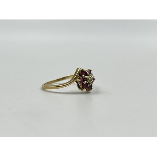 45 - 9ct gold ruby and diamond floral dress ring, size N. Shipping Group (A).