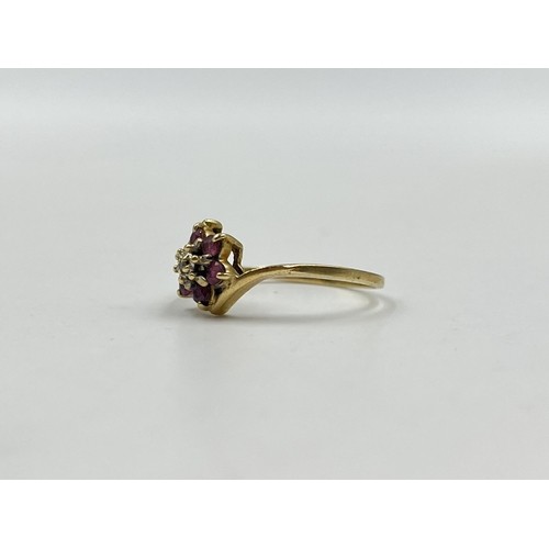 45 - 9ct gold ruby and diamond floral dress ring, size N. Shipping Group (A).