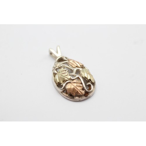 39 - Sterling silver floral design pendant and matching ring, overlaid in 12ct yellow and rose gold. Ring... 