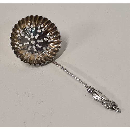 63 - Silver sifter spoon, hallmark for London. Together with an earlier white metal spoon. Shipping Group... 