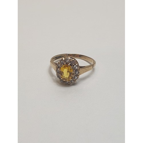 49 - 9ct gold citrine and cubic zirconia set ring. Hallmark for Birmingham. Size M½. Shipping Group (A).