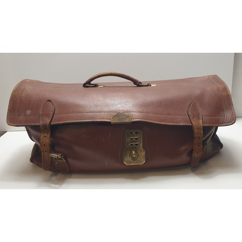 107 - Leather holdall containing vintage ladies girdles. Collection only.