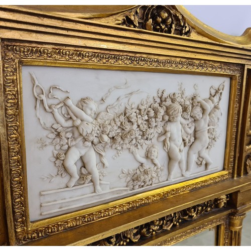 2 - A superb and imposing three-section plate mirror glass overmantel, having gilt frame, inset cherub f... 